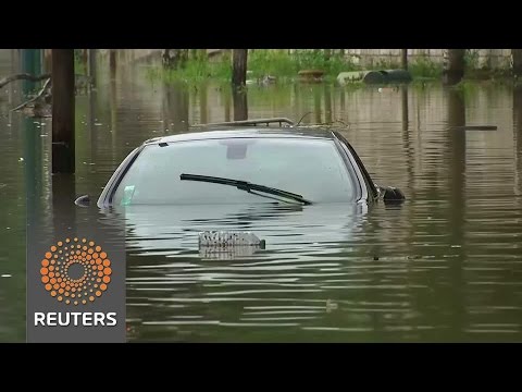 parisians fear long recovery as seine river slowly recedes