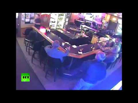 kissing couple oblivious to armed robbery at montanas bar