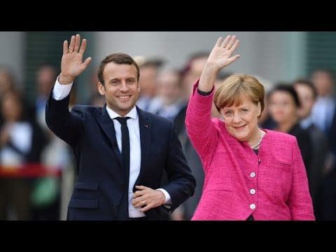 macron meets merkel on first day in office