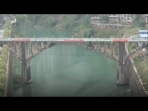 bridge demolished by explosives and falls into the river