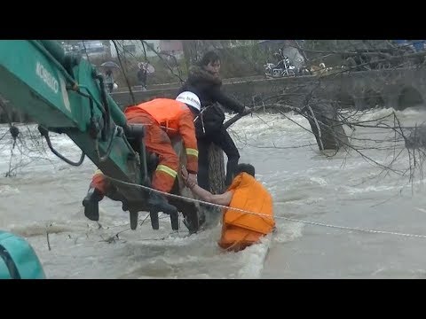 firefighters use excavator to save woman trapped