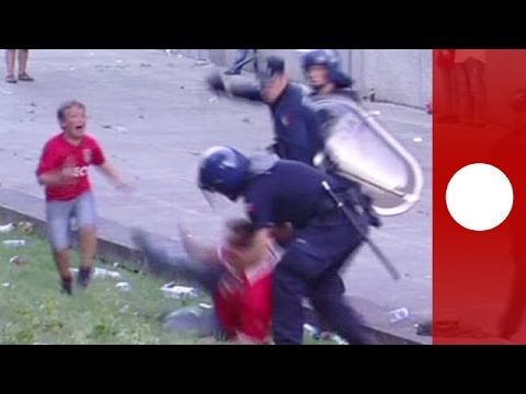 police beat football supporter in front of his children