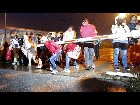 relieved migrants cross hungaryaustria border