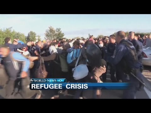 police clash with refugees in hungary