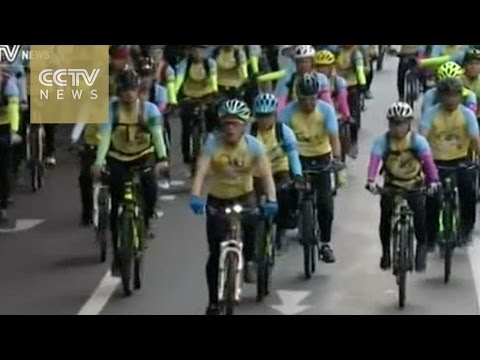 thousands of cyclists have streamed through bangkok