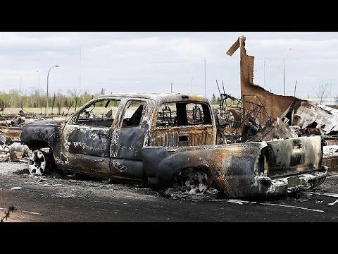 damage less than feared as canada wildfire slows down