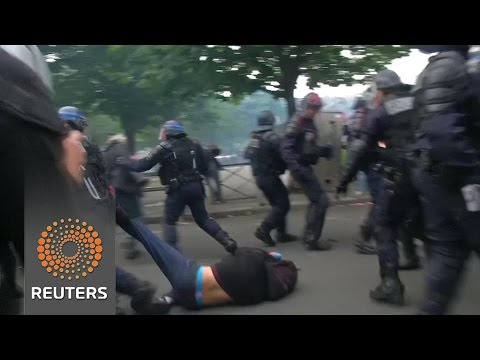 teargas clashes in paris amid