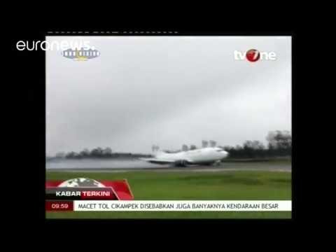 plane skids off runway in indonesia