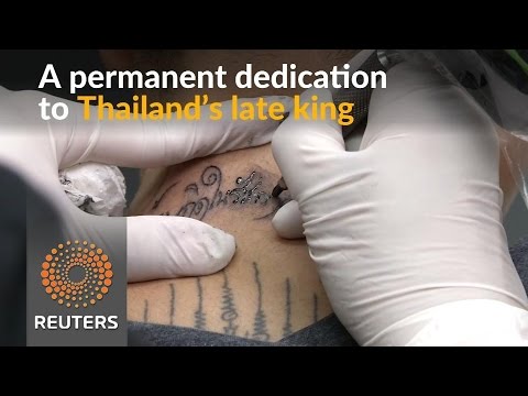 thais pay respect to king bhumibol through tattoos