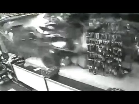 truck smashed into gun shop