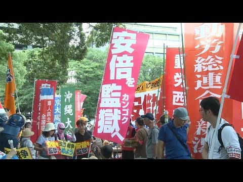 protesters rally against shinzo abe