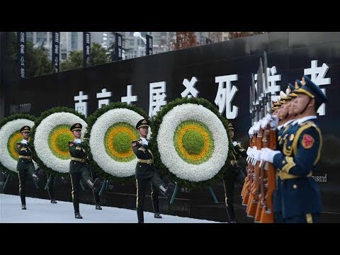 guard of honor presents flowers during memorial ceremony