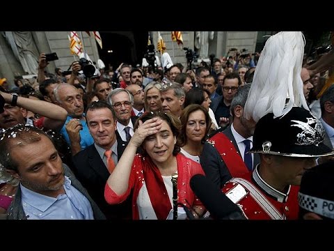 antiausterity leaders sworn in as madridbarcelona mayors