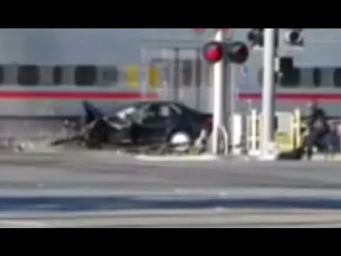 cop saves driver stuck on railway crossing