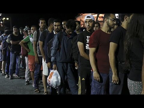 syria refugees begin boarding greek passenger ship