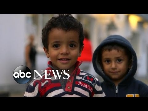 germany opens its doors to over 20000 refugees