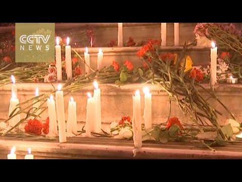 mourners around the world pay tribute